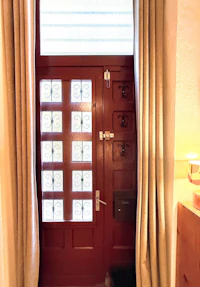 a room with a door leading to a bathroom
